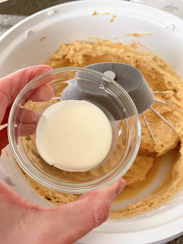Add 1 tablespoon of milk or cream and beat the frosting for 1-3 minutes.