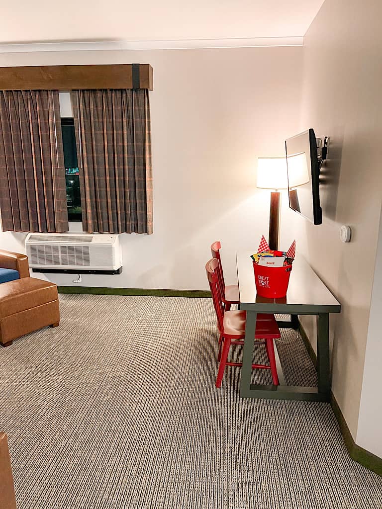 Desk and TV in living room of Grizzly Bear Suite at Great Wolf Lodge Arizona