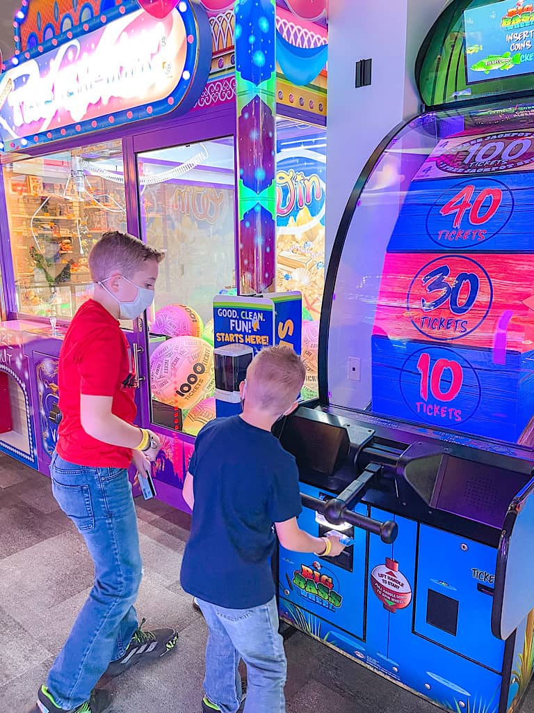 Two kids playing an arcade game at Great Wolf Lodge