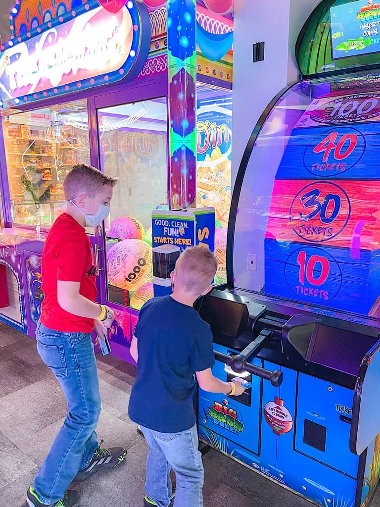 Two kids playing an arcade game at Great Wolf Lodge