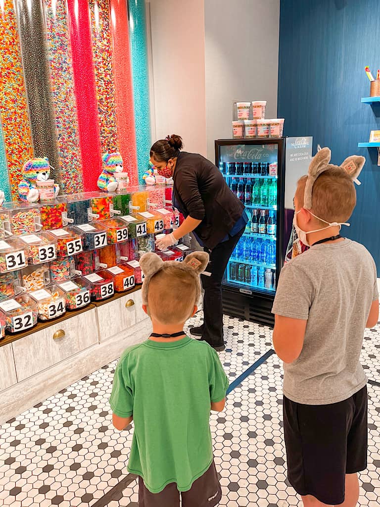 Two boys getting candy from a Great Wolf Lodge employee