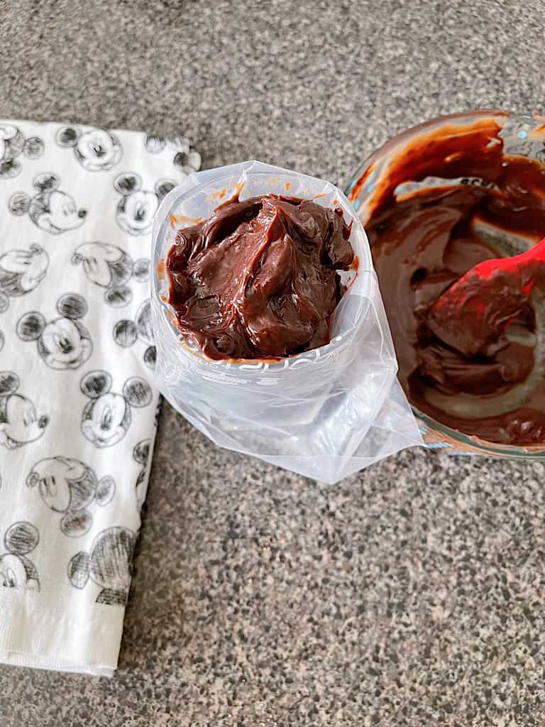 Add the chocolate ganache to a large piping bag or ziplock bag.