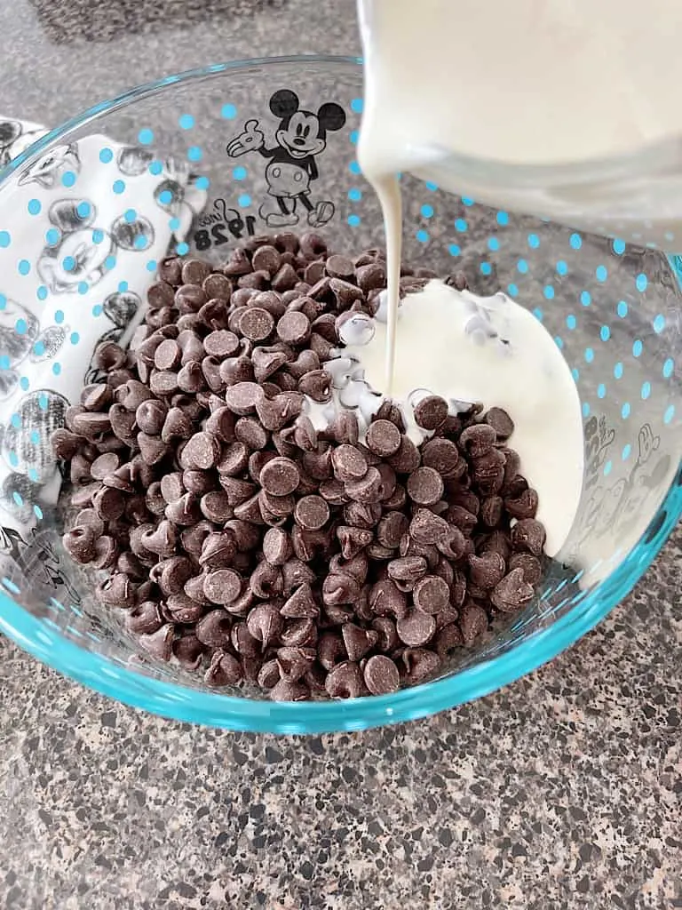 Pour the cream over the top of the chocolate chips.