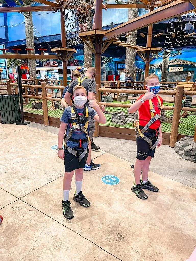 Two young boys in climbing harnesses at Great Wolf Lodge