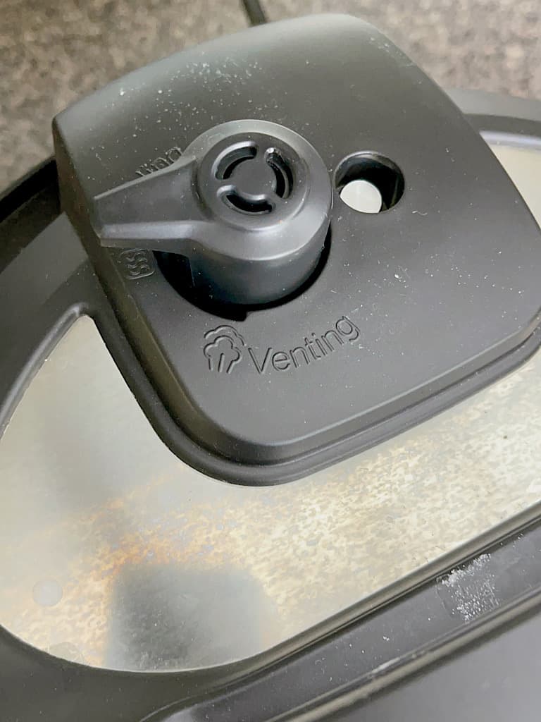 An Instant Pot lid set to seal.
