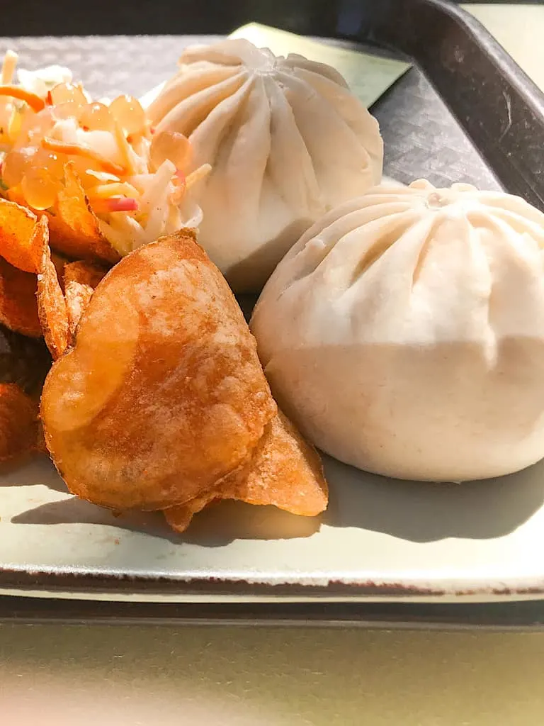 Cheeseburger Steamed Pods on a tray from Satu'li Canteen at Disney's Animal Kingdom.