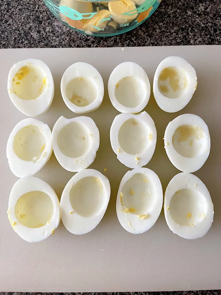 Hard boiled egg whites cut in half with the yolks removed.