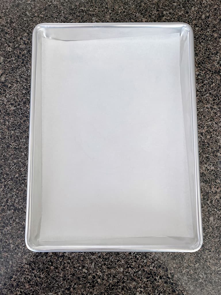 A baking sheet lined with parchment paper.