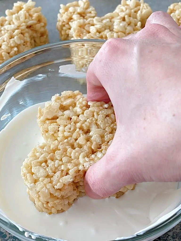 A Mickey Rice Krispie Treat dipped into white candy melts.