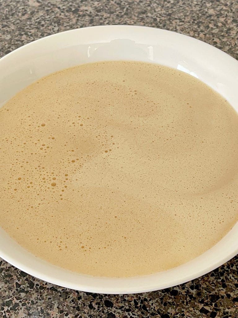 French Toast batter in a white bowl.