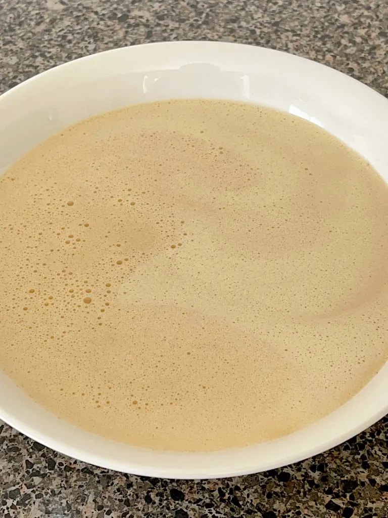 French Toast batter in a white bowl.
