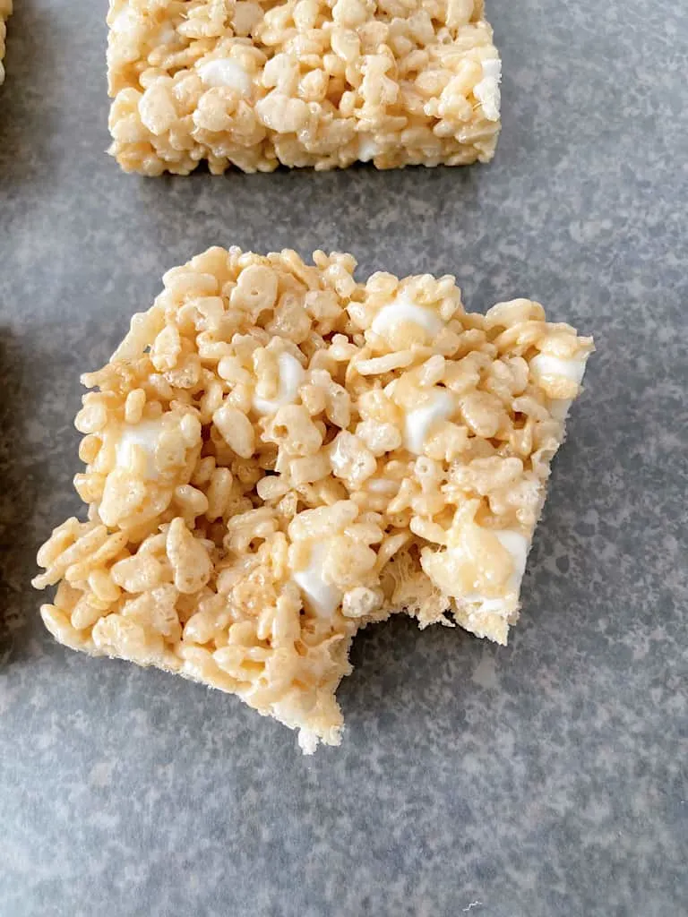 A Rice Krispie Treat with a bite taken out of it.