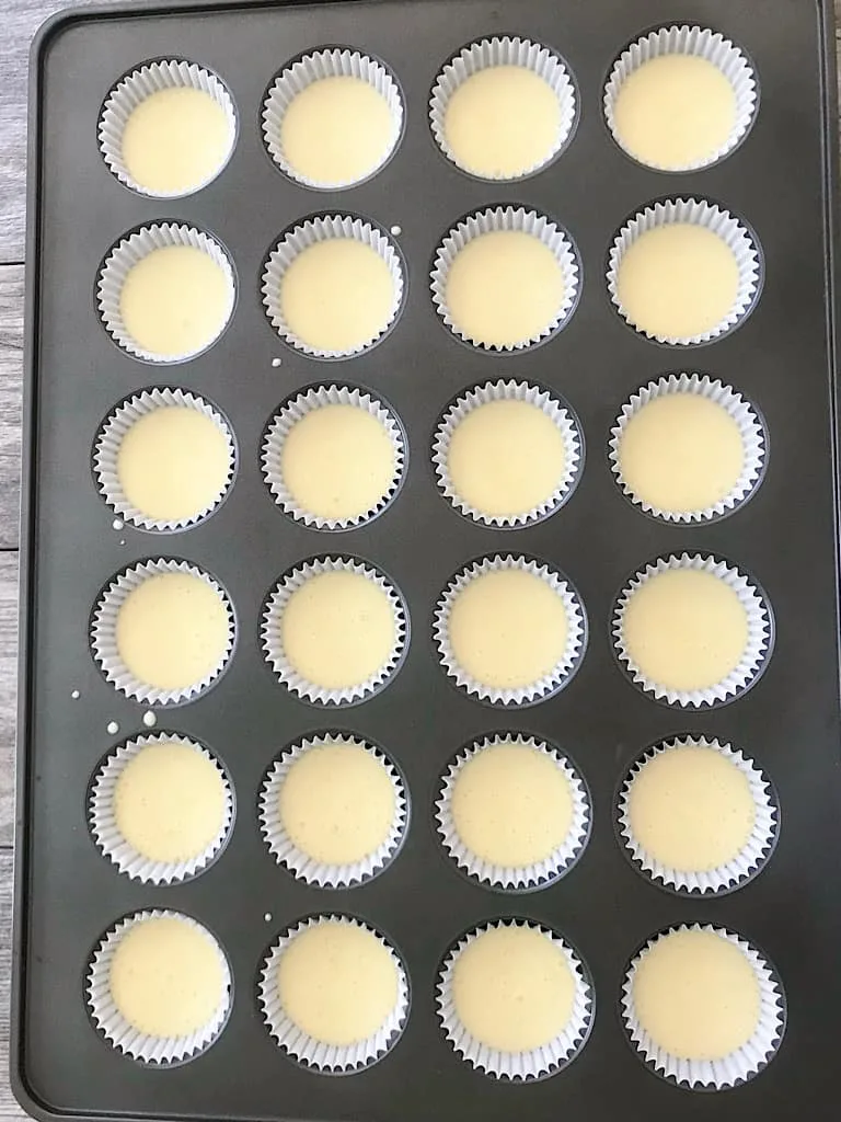 Unbaked cupcake batter in a cupcake pan.