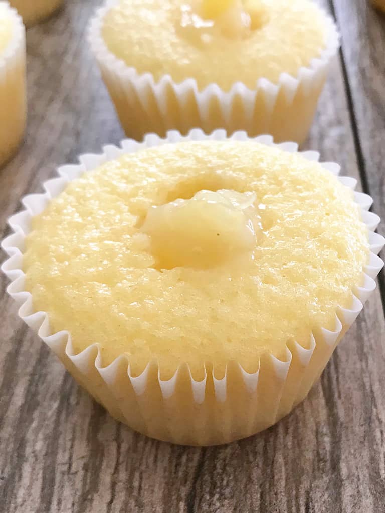 A pineapple cupcake with pineapple filling.