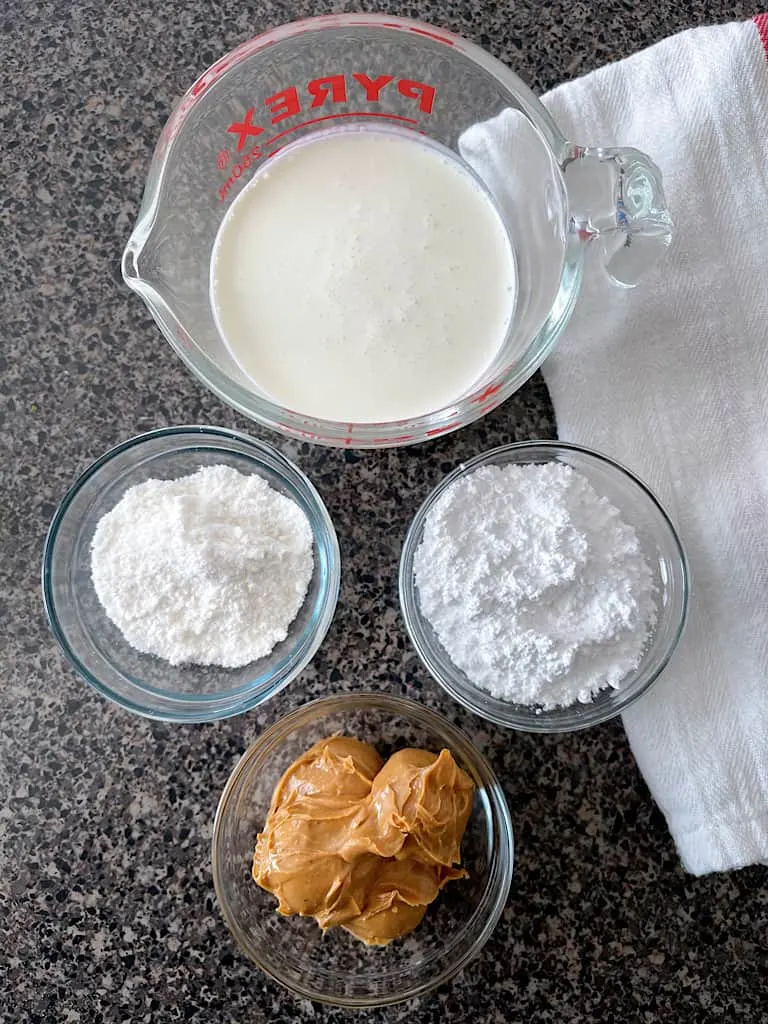 Heavy whipping cream, instant pudding mix, powdered sugar, and peanut butter to make Peanut Butter Whipped Cream.