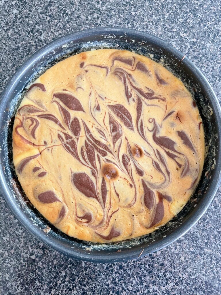 A baked caramel pecan turtle cheesecake.