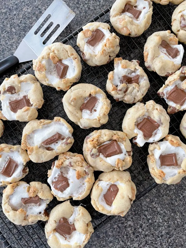 S'mores Cookies with Graham Crackers on a cooling rack.