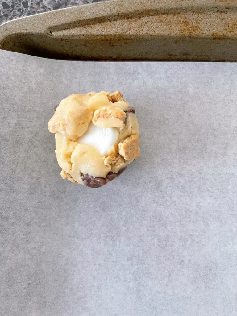 Close up of a s'more cookie dough ball.