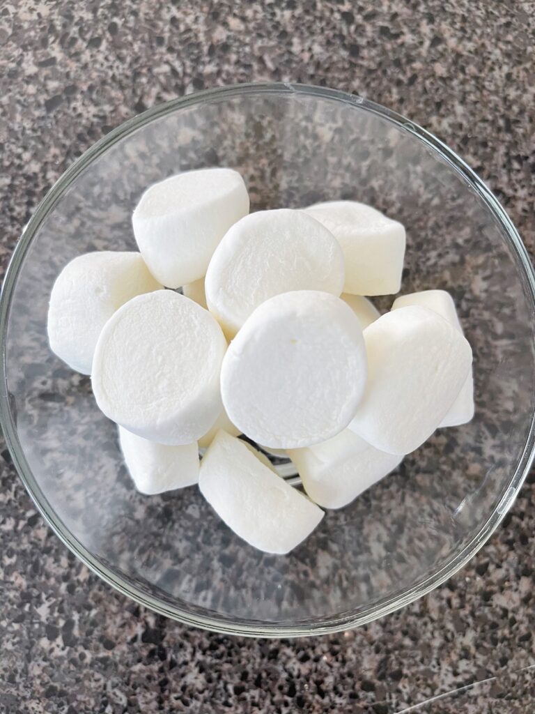 A bowl of jumbo marshmallows cut in half.