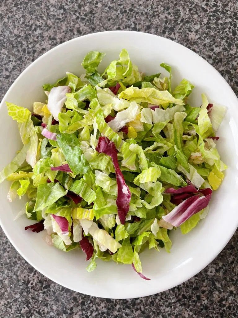 A bowl of chopped romaine lettuce.