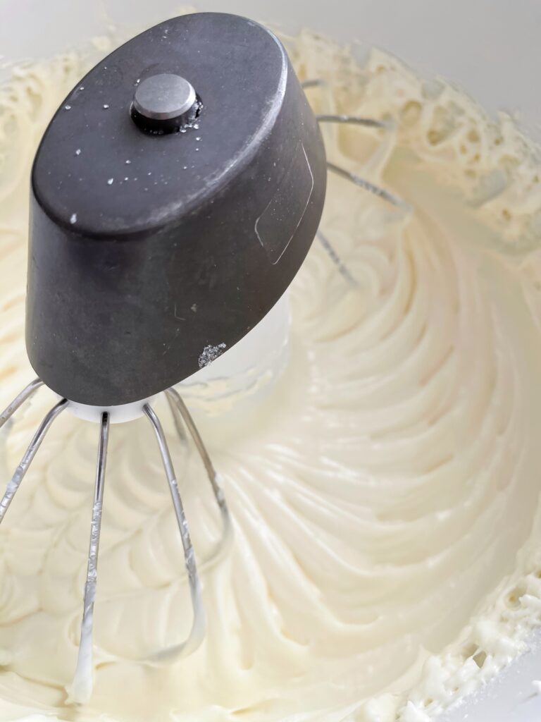 Cream cheese beaten in a stand mixer with a whisk attachment.