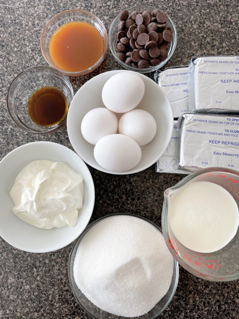 Ingredients to make Caramel Pecan Turtle Cheesecake.
