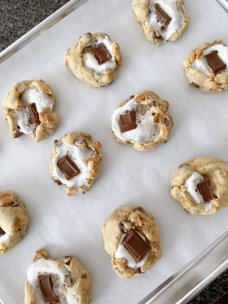 Freshly baked S'more's cookies on a baking sheet.