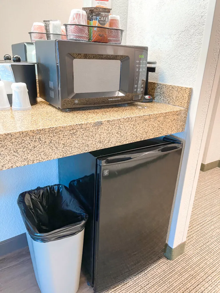 Microwave, coffee maker, and small refrigerator in a Grizzly Bear Suite.