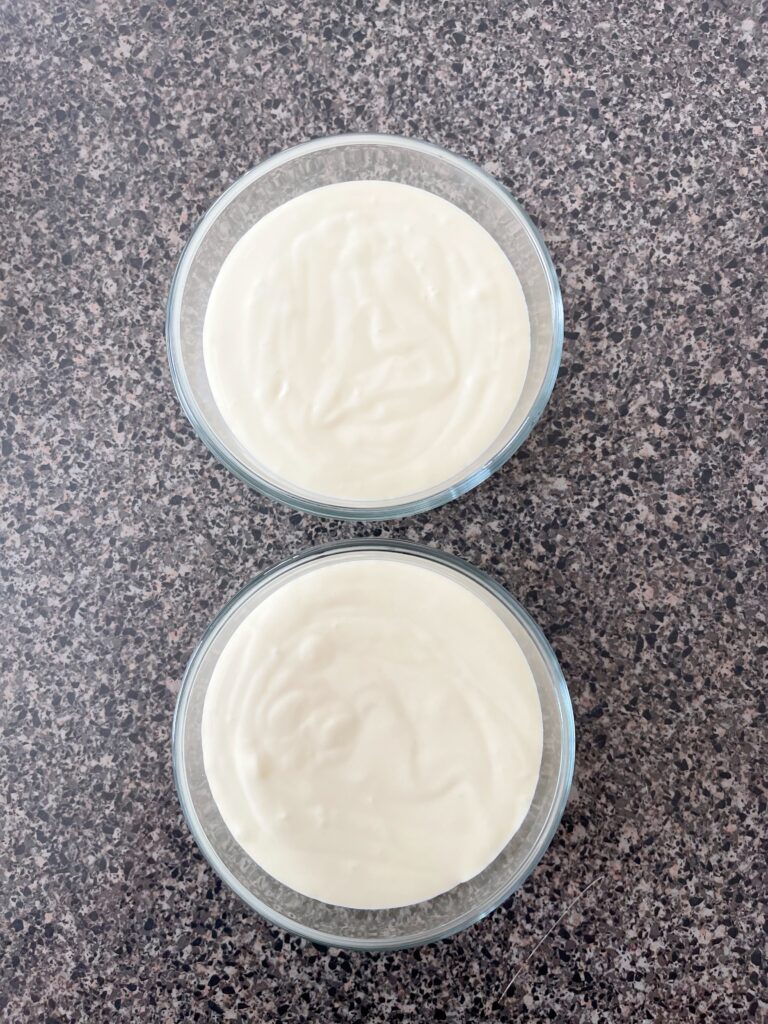 Two bowls of cheesecake batter.
