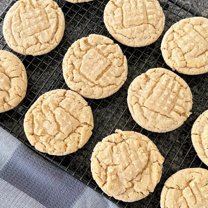 Peanut butter cookies on a cooling rack.