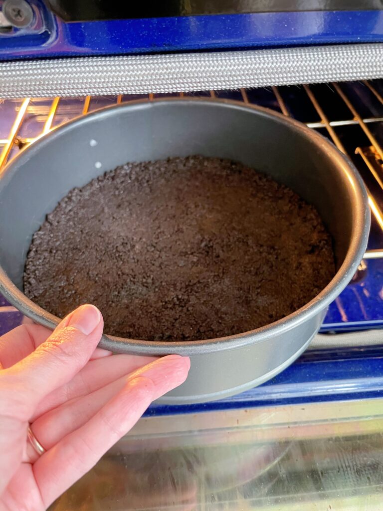 Baking a cookie crust in the oven.