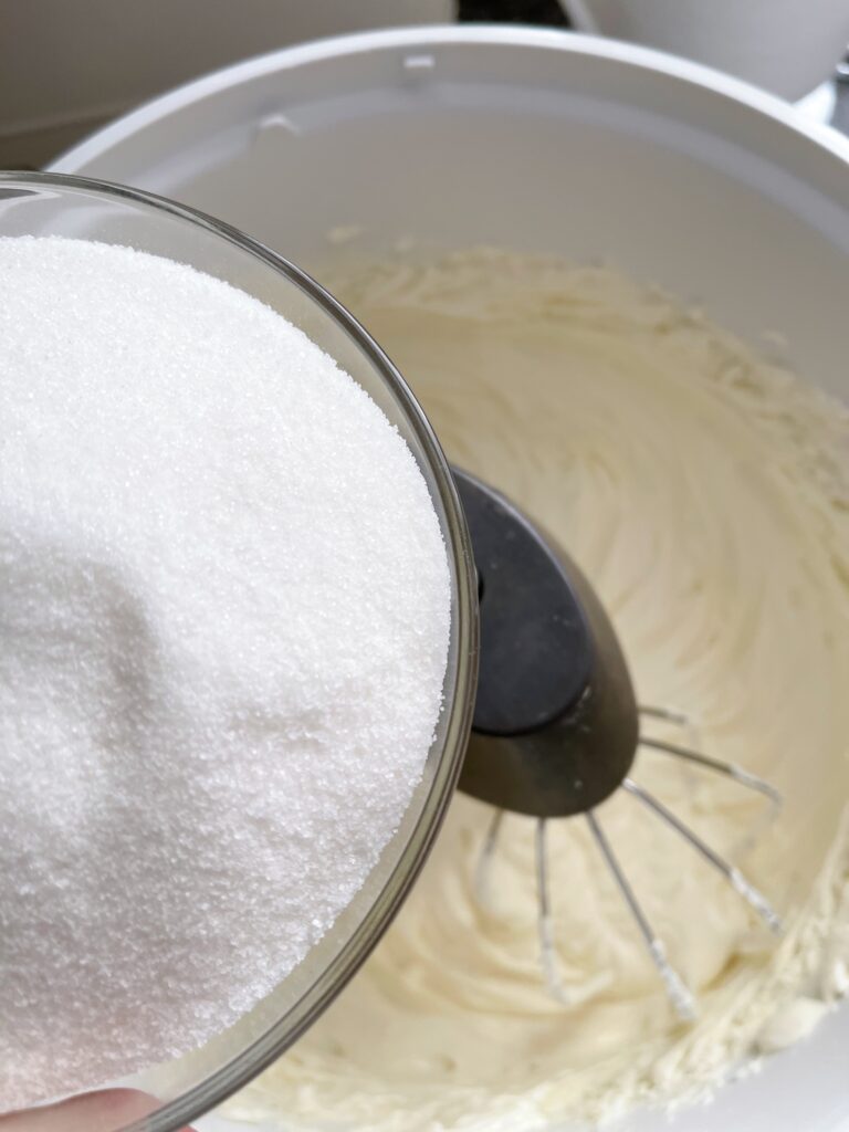 Sugar added to cheesecake batter.