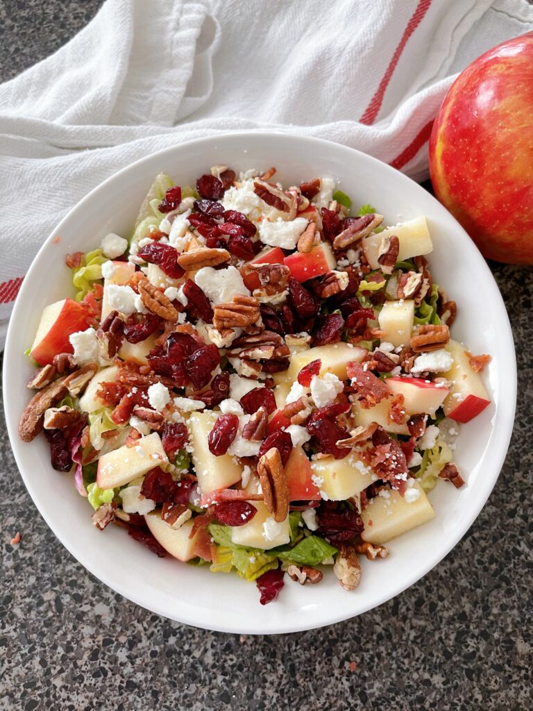 A bowl filled with Honeycrisp Harvest Salad.