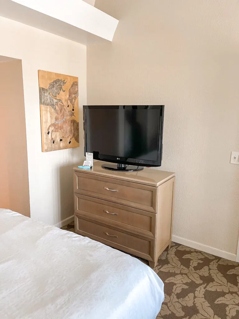 Dresser and TV in guest room at Best Western Island Palms.
