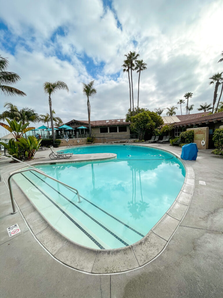 Swimming pool with palm trees at Best Western Island Palms Hotel.