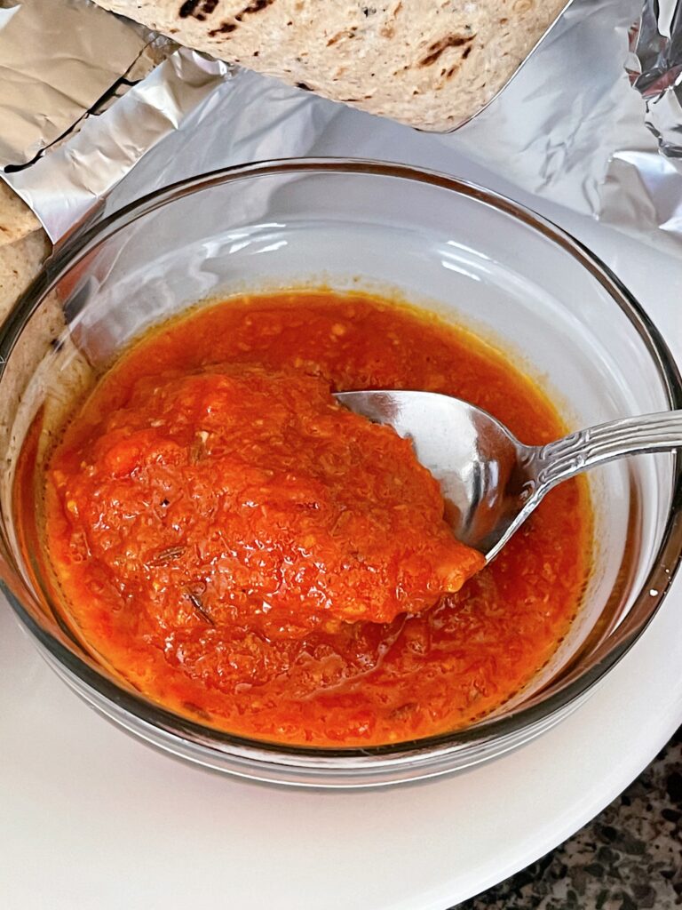 A bowl of red sauce for gyros.