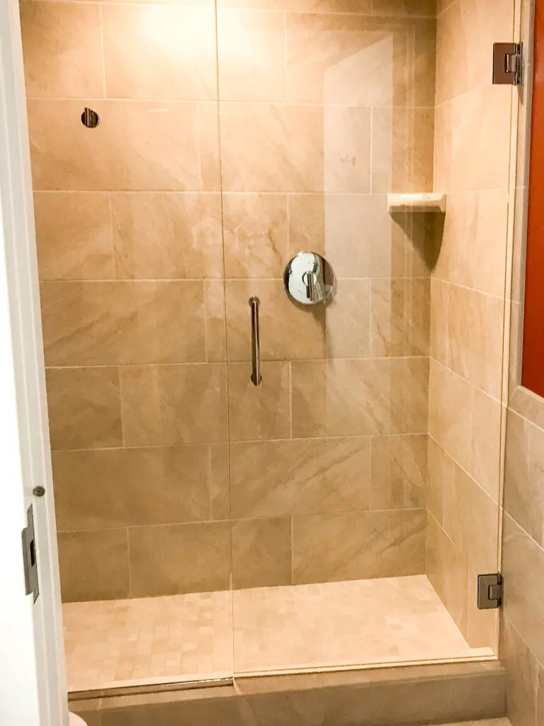 Stand up shower inside a guest room at Courtyard Anaheim Theme Park Entrance.
