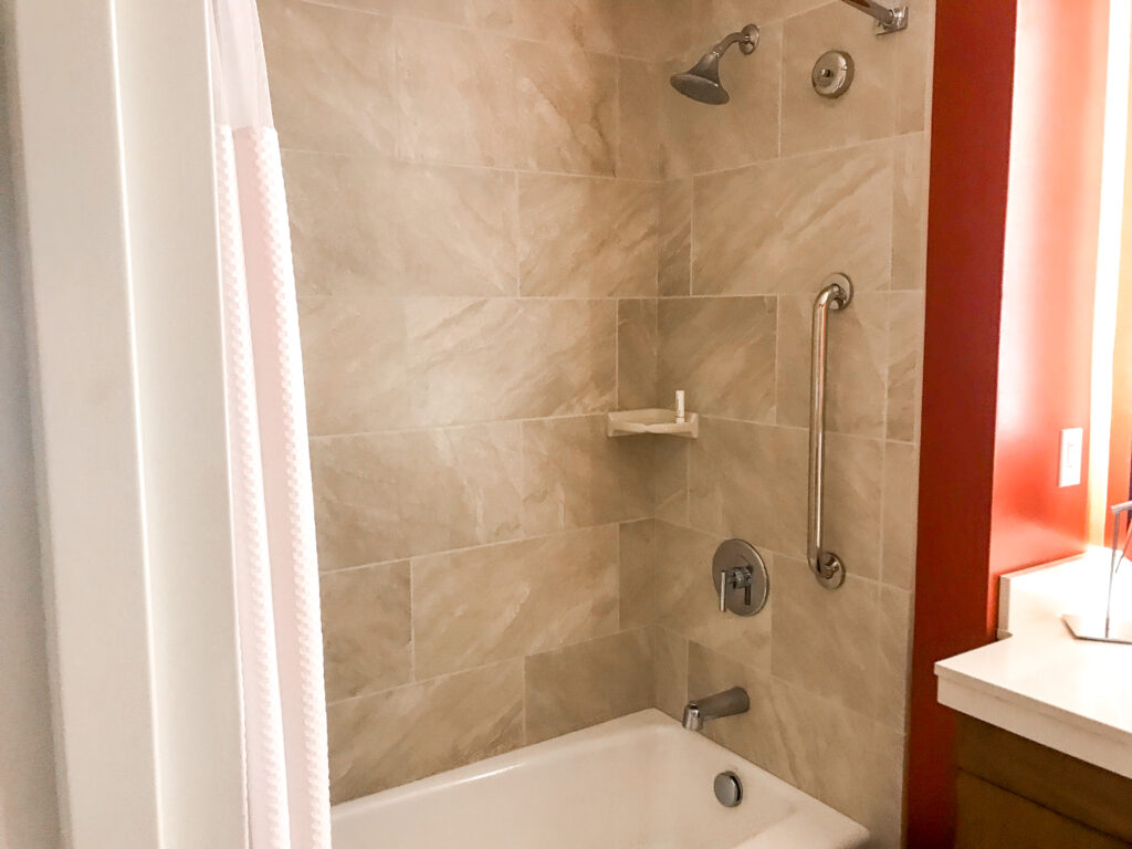 Shower tub combination in a guest room at Courtyard Anaheim Theme Park Entrance.