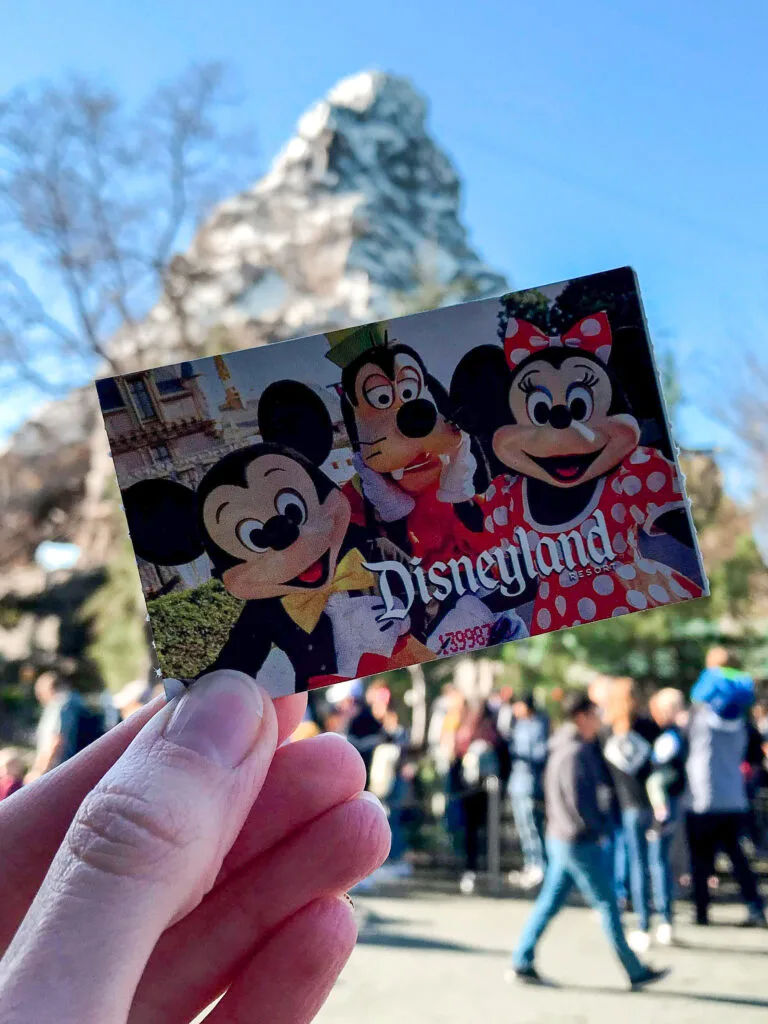 Disneyland ticket in front of Matterhorn Boblseds.
