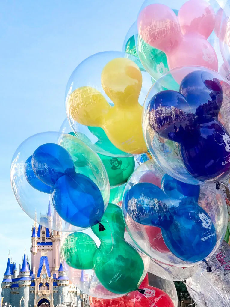 Mickey balloons outside Cinderella's Castle.