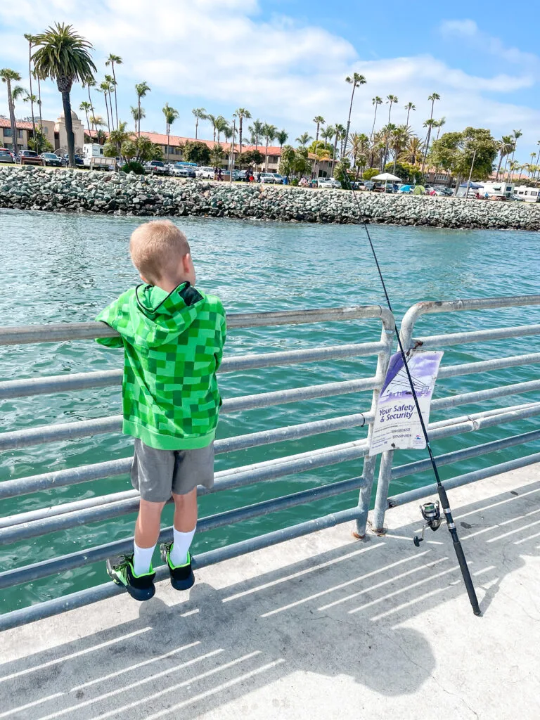 A boy fishing on the Shelter Island Pier.