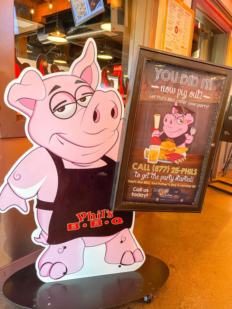 A sign with a pig advertising Phil's BBQ in San Diego.