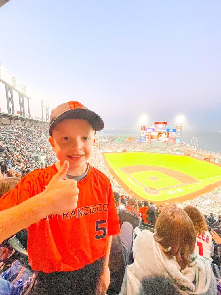 A boy in a San Francisco Giants uniform at Oracle Park.