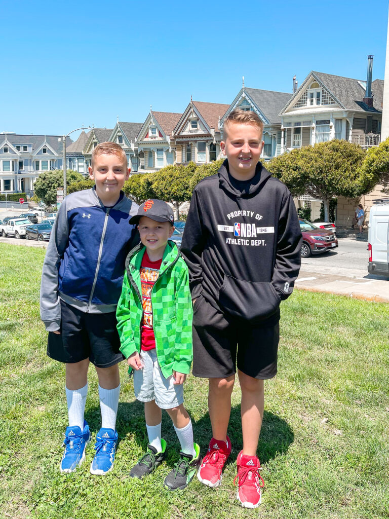 Three kids in front of the Painted Ladies in San Francisco.