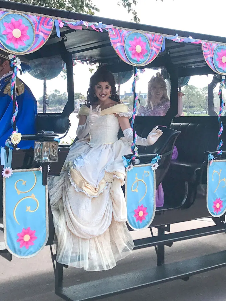Disney princesses in a car at Epcot.