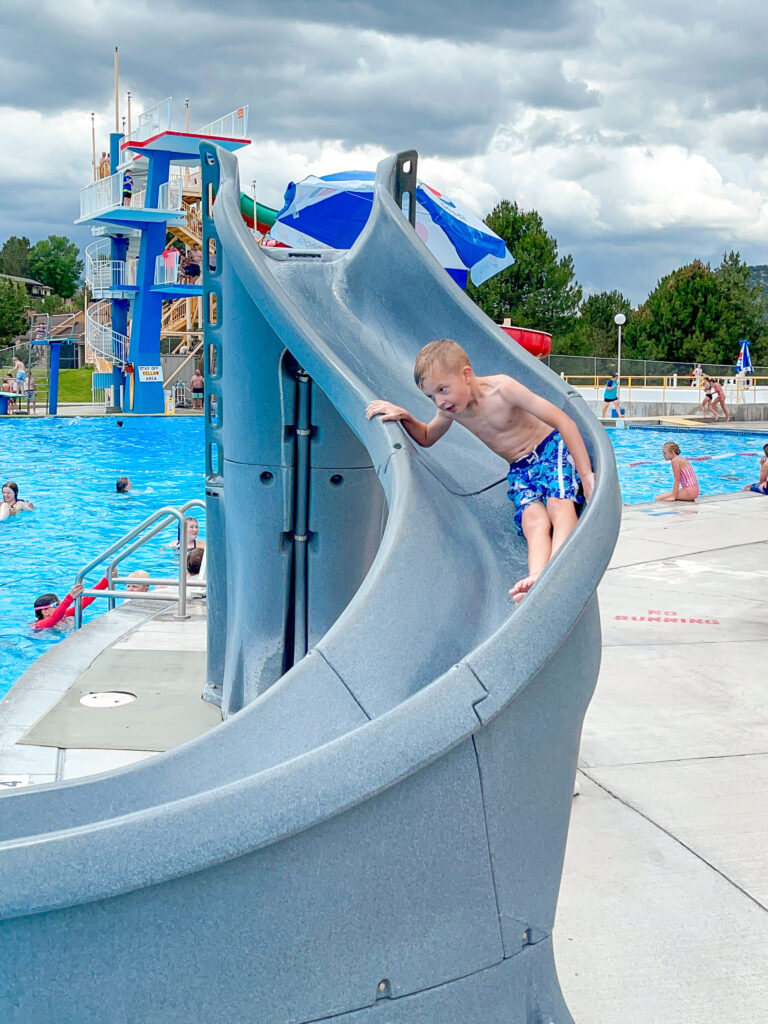 A boy going down a water slide at Lava Hot Springs.