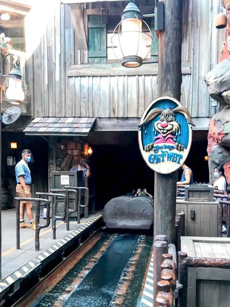 Beginning of Splash Mountain and a sign that says "You May Get Wet".