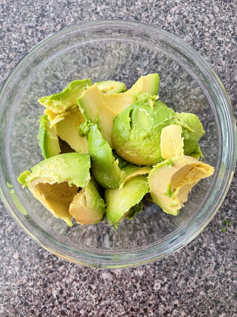 Avocado flesh in a bowl.