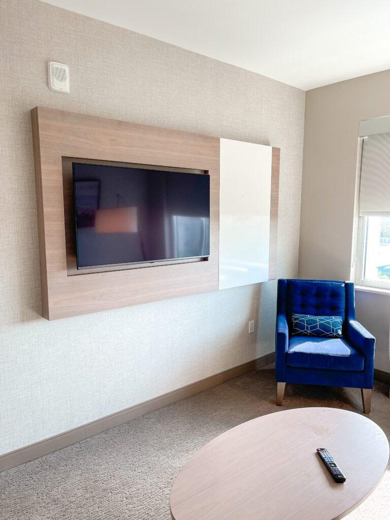 Chair and television in the living room of a kids suite.