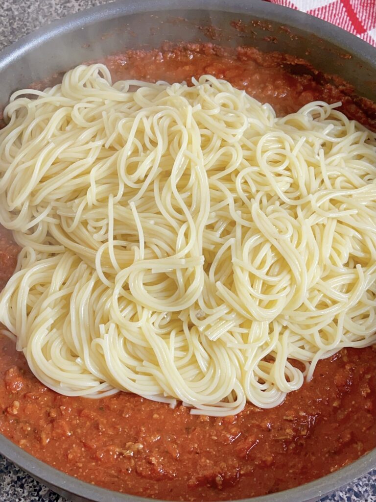 Spaghetti noodles and spaghetti sauce.